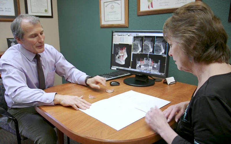 Dr. Howard talking to a female patient