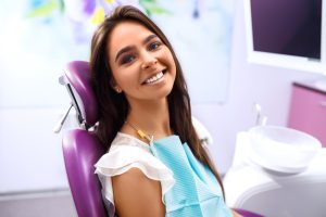 smiling woman in dental chair